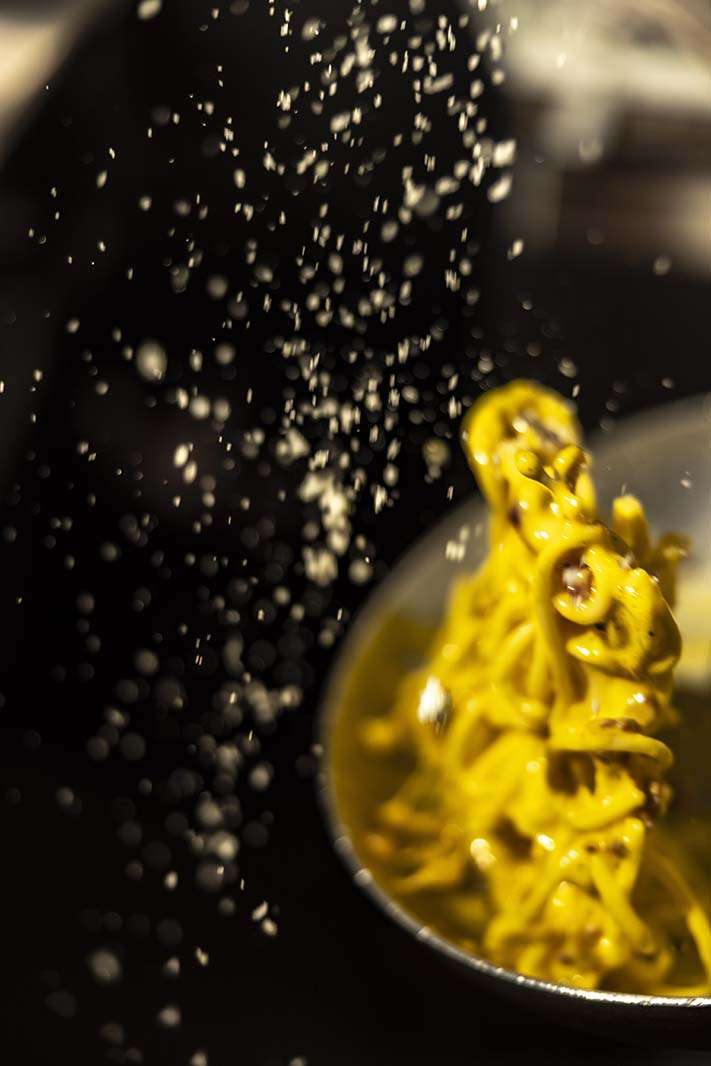 a perfect carbonara the sprinkling of Parmesan on a carbonara