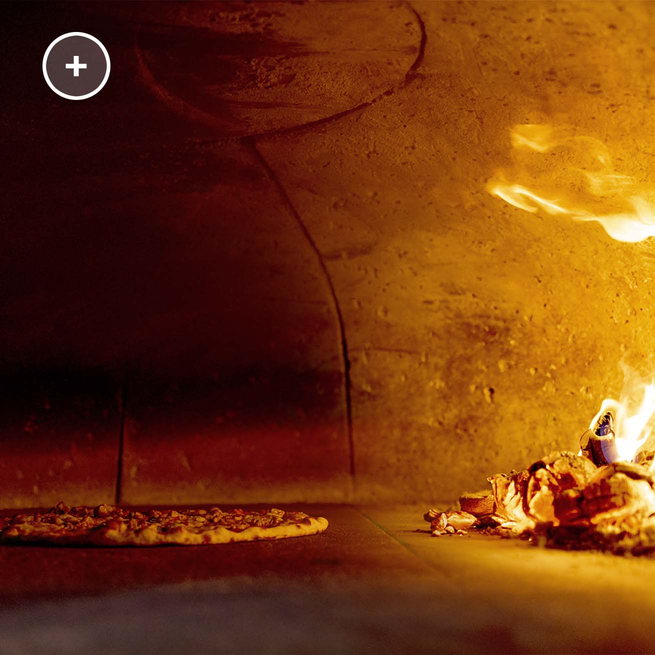 pizza cooked in a wood oven